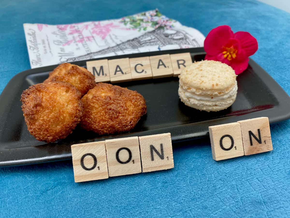coconut macaroons next to a Parisian macaron to show the difference