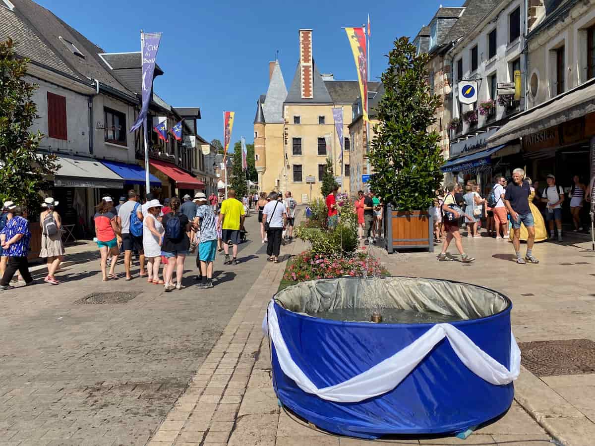 round fountain dressed in blue and white on main street to look like the Scottish flag