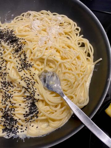 pan of cooked spaghetti, tossed with a creamy lemon pasta sauce with parmesan and poppy seeds