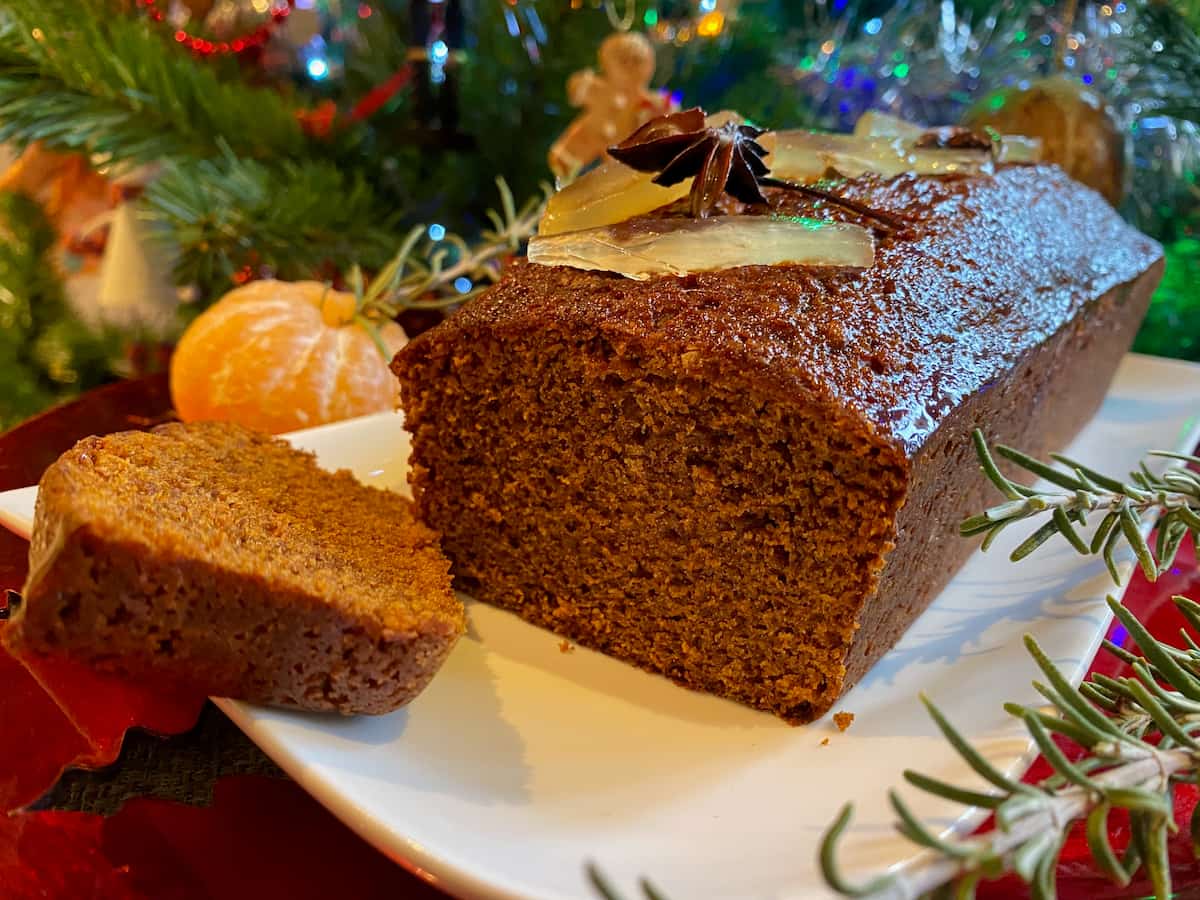 slice cut to show inside of a moist gingerbread loaf
