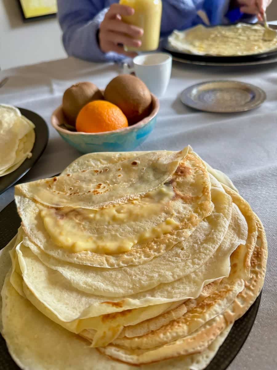 stack of French crêpes, thin pancakes topped with orange curd