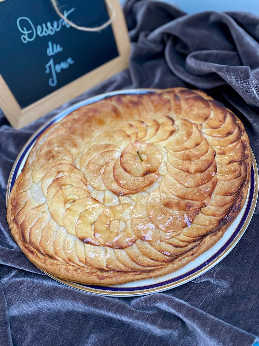 thin apple tart with rounds of thinly sliced apples shining in the light