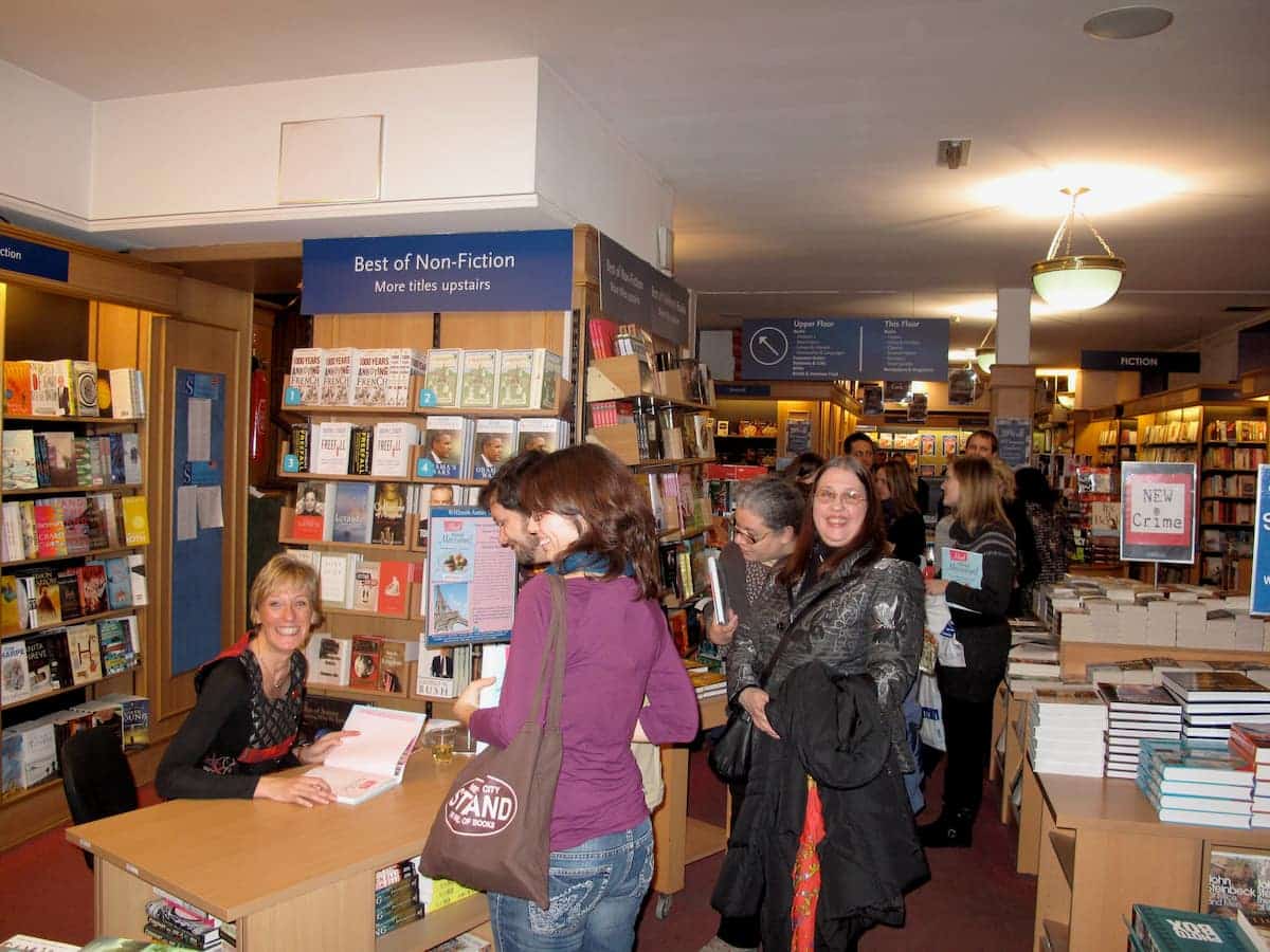 Jill Colonna signing books at a Mad About Macarons book launch