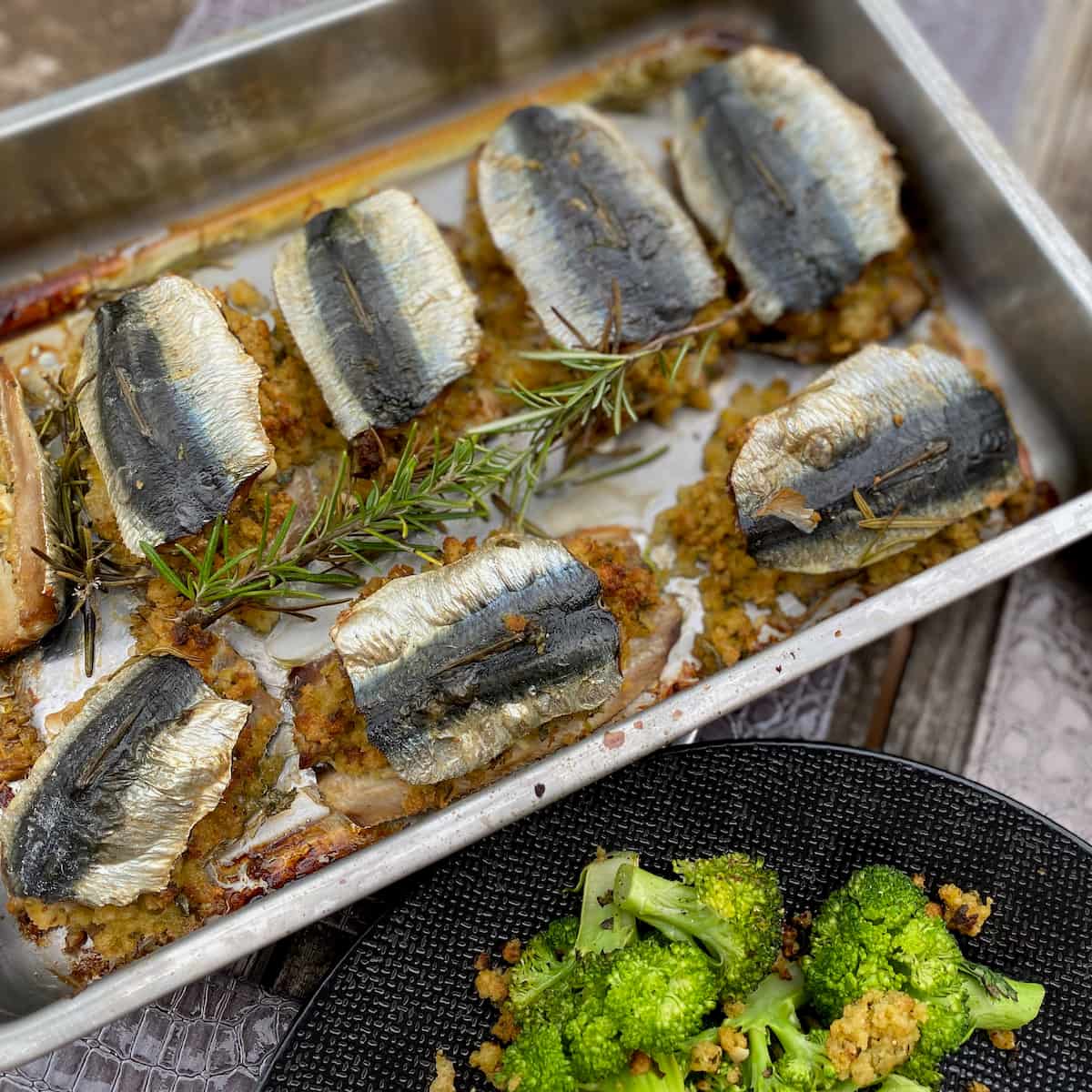 roasting tin of fresh sardines baked with a stuffing of garlic, herbs and breadcrumbs