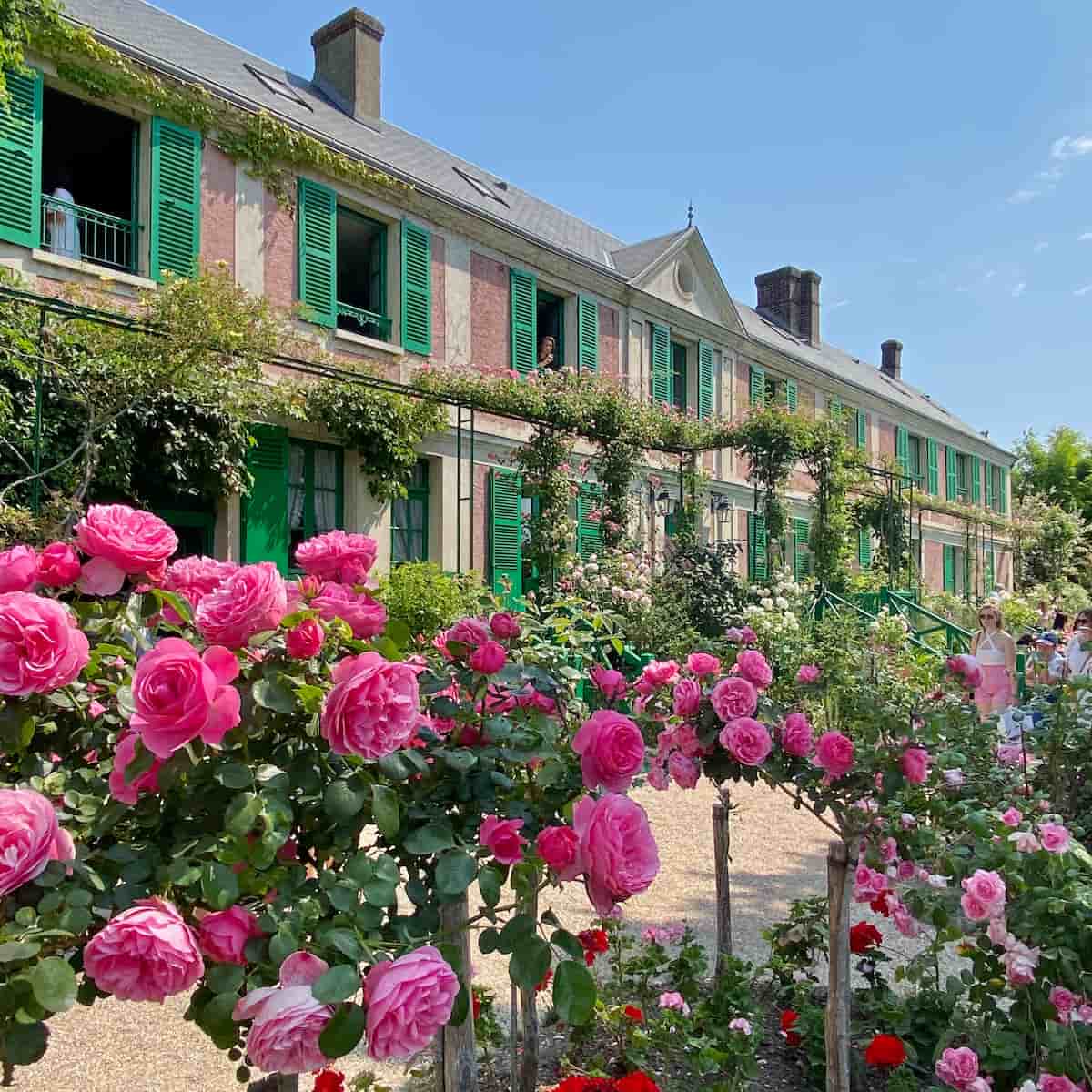 Monet's house and gardens with roses and green shutters