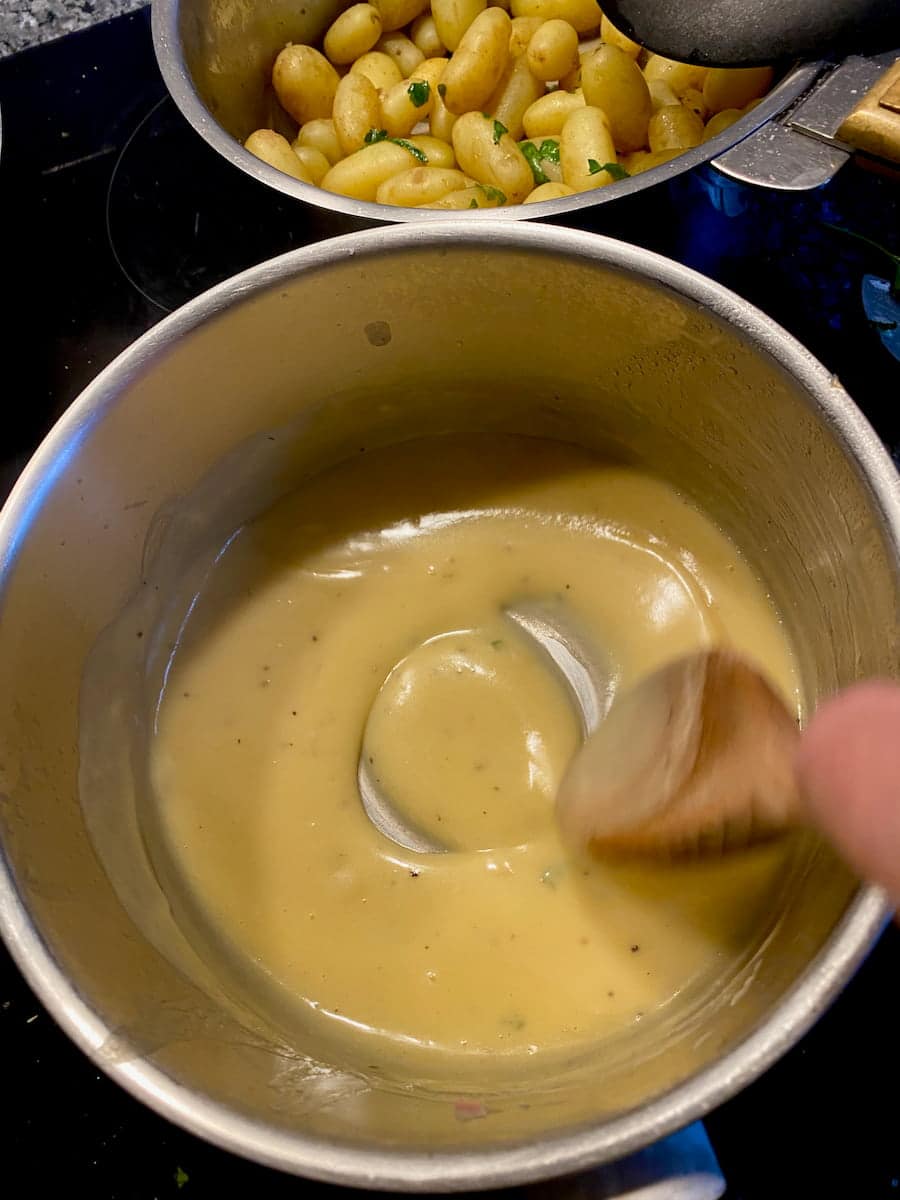 stirring the sauce until thick with a wooden spoon until the bottom of the pan can be seen