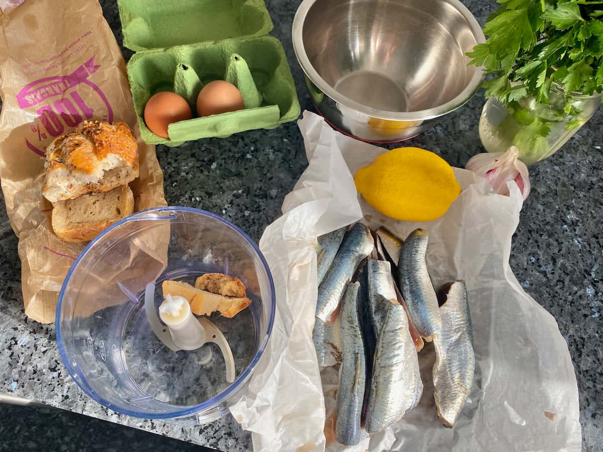 eggs, lemon, parsley, garlic, french baguette and sardines all ready to prepare the dish