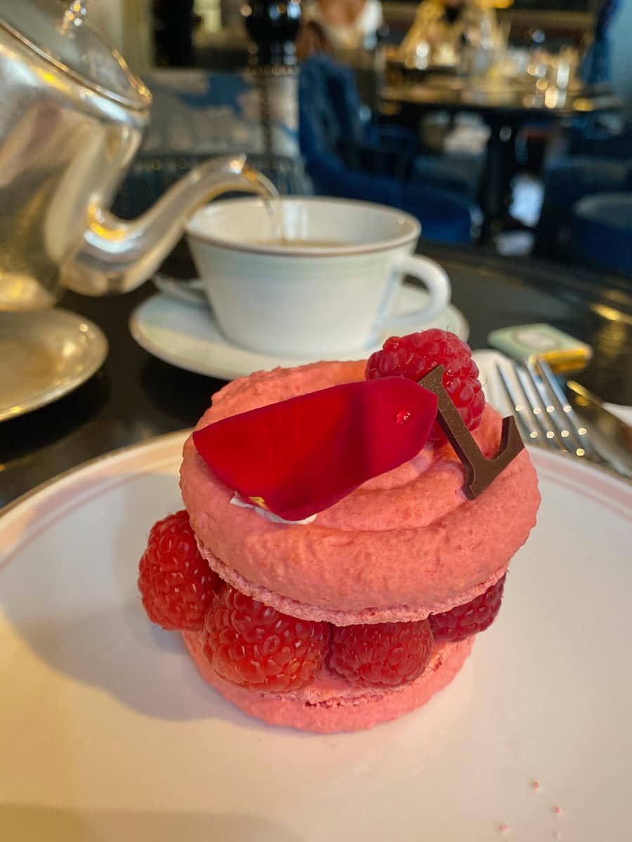 pink macaron shells with raspberries and rose