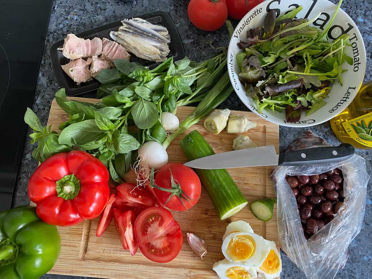 all raw ingredients that make up a classic Nicoise salad except the boiled egg - without green beans or potatoes