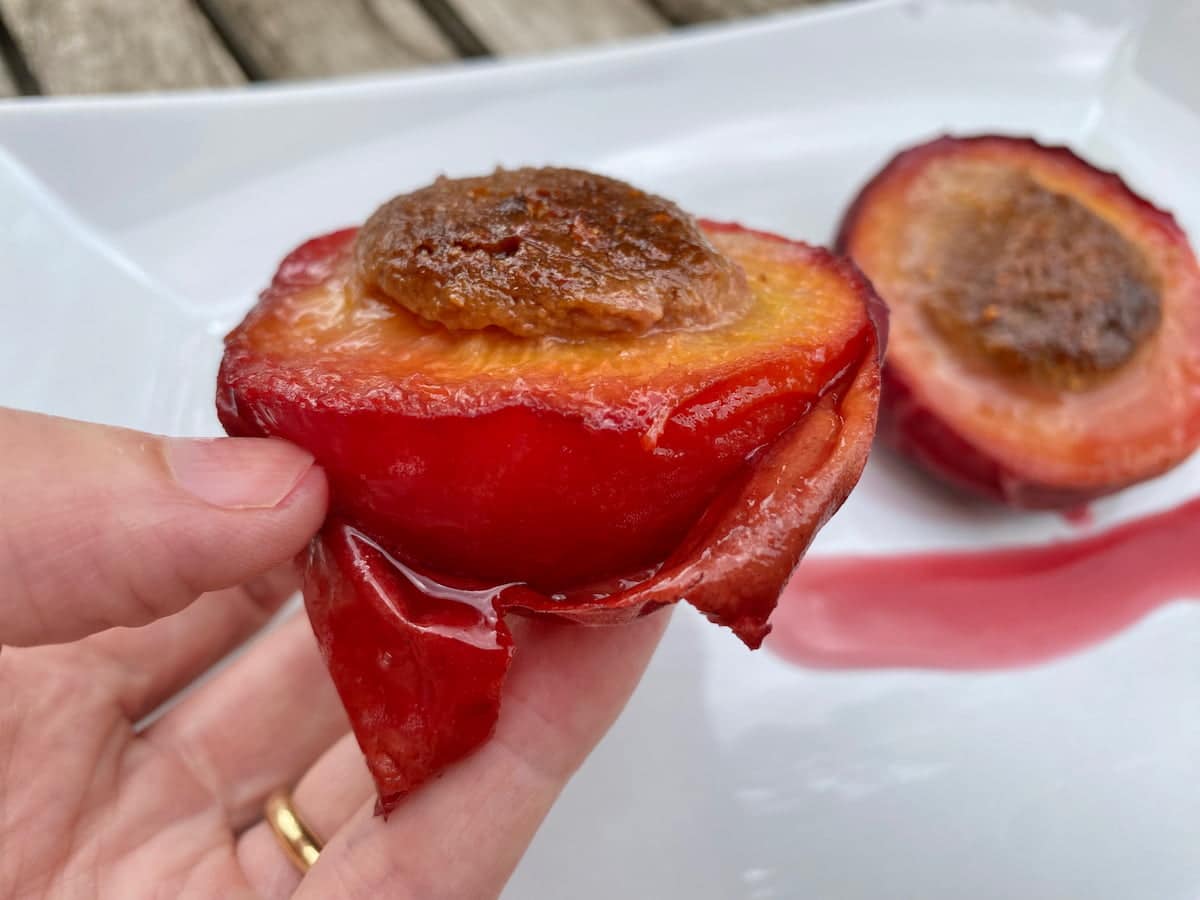 peeling the skin easily off a peach that has been baked and chilled