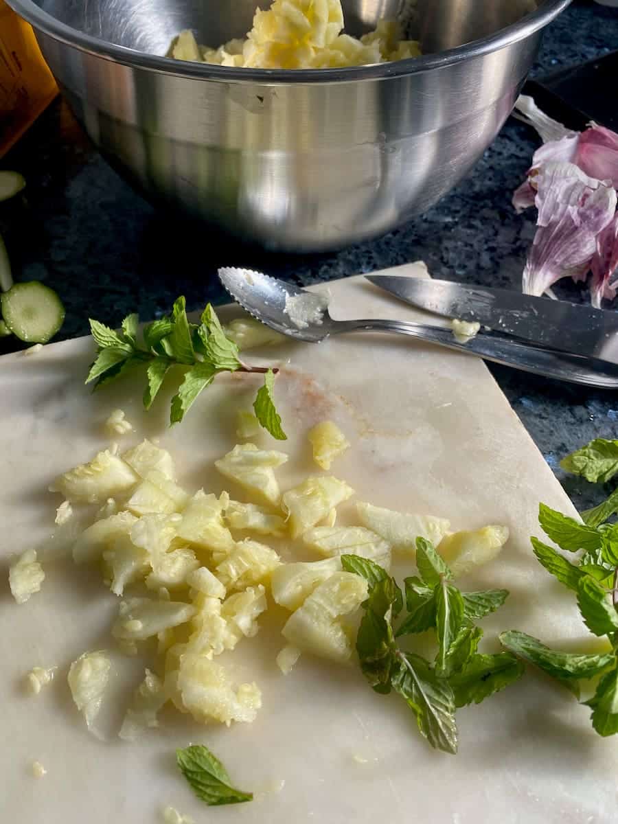 chopping up zucchini pulp