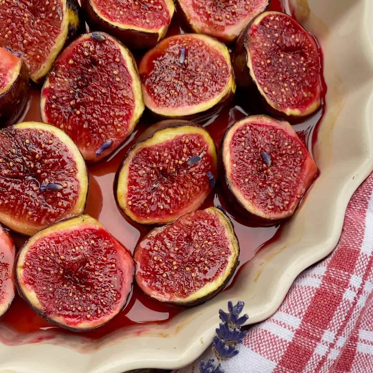 close-up of shiny roasted figs in honey and port