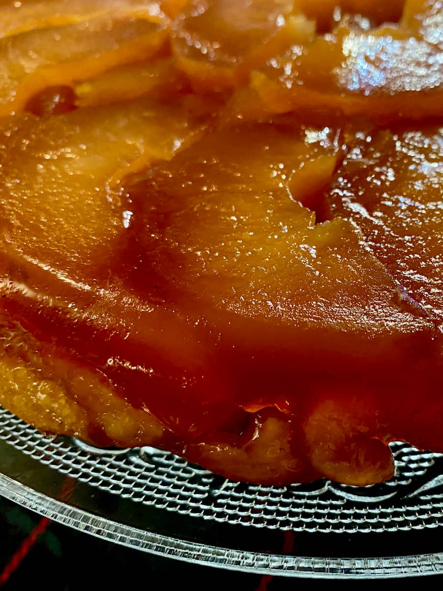 shiny caramel apples on top of buttery pastry, for a Tarte Tatin or upside down French apple dessert