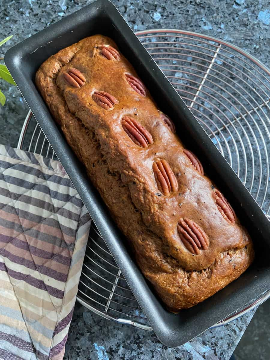 banana cake cooling for a few minutes in the tin