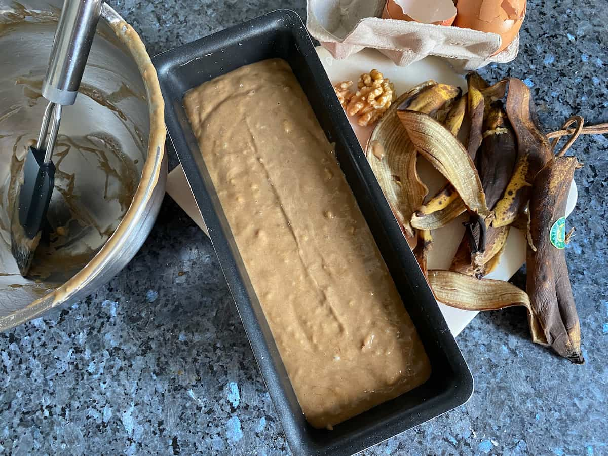 cake batter in tin before baking