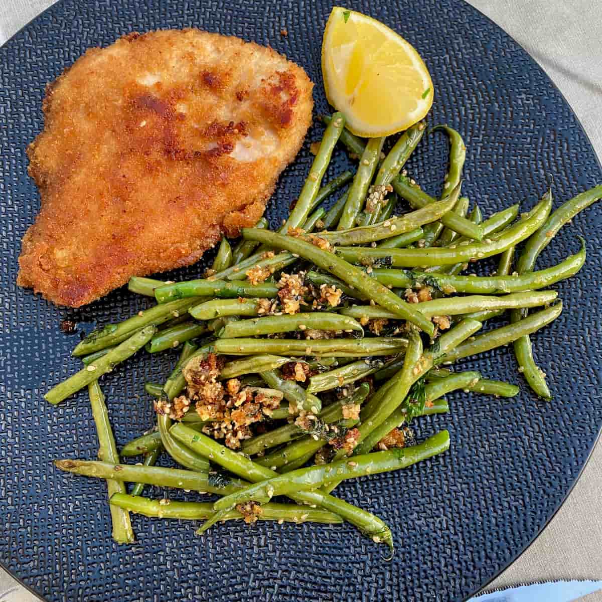 fried green or string beans in breadcrumbs, garlic, herbs and seeds in oil and butter with breaded turkey