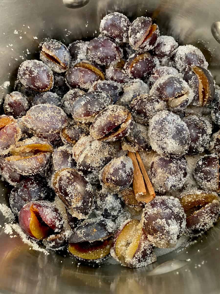 halved French quetsch plums covered in sugar and spices