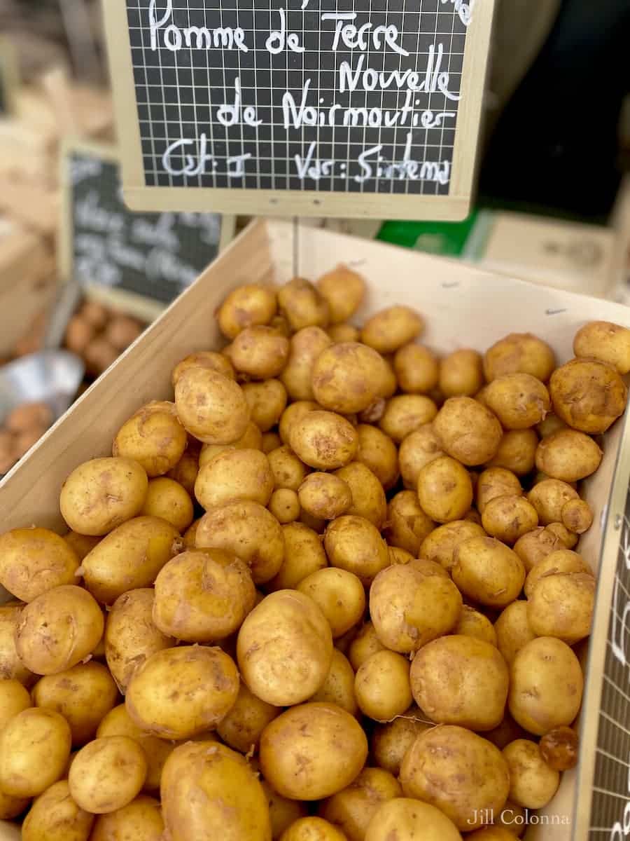 French new potatoes, marked Pomme de Terre Nouvelle de Noirmoutier at the market