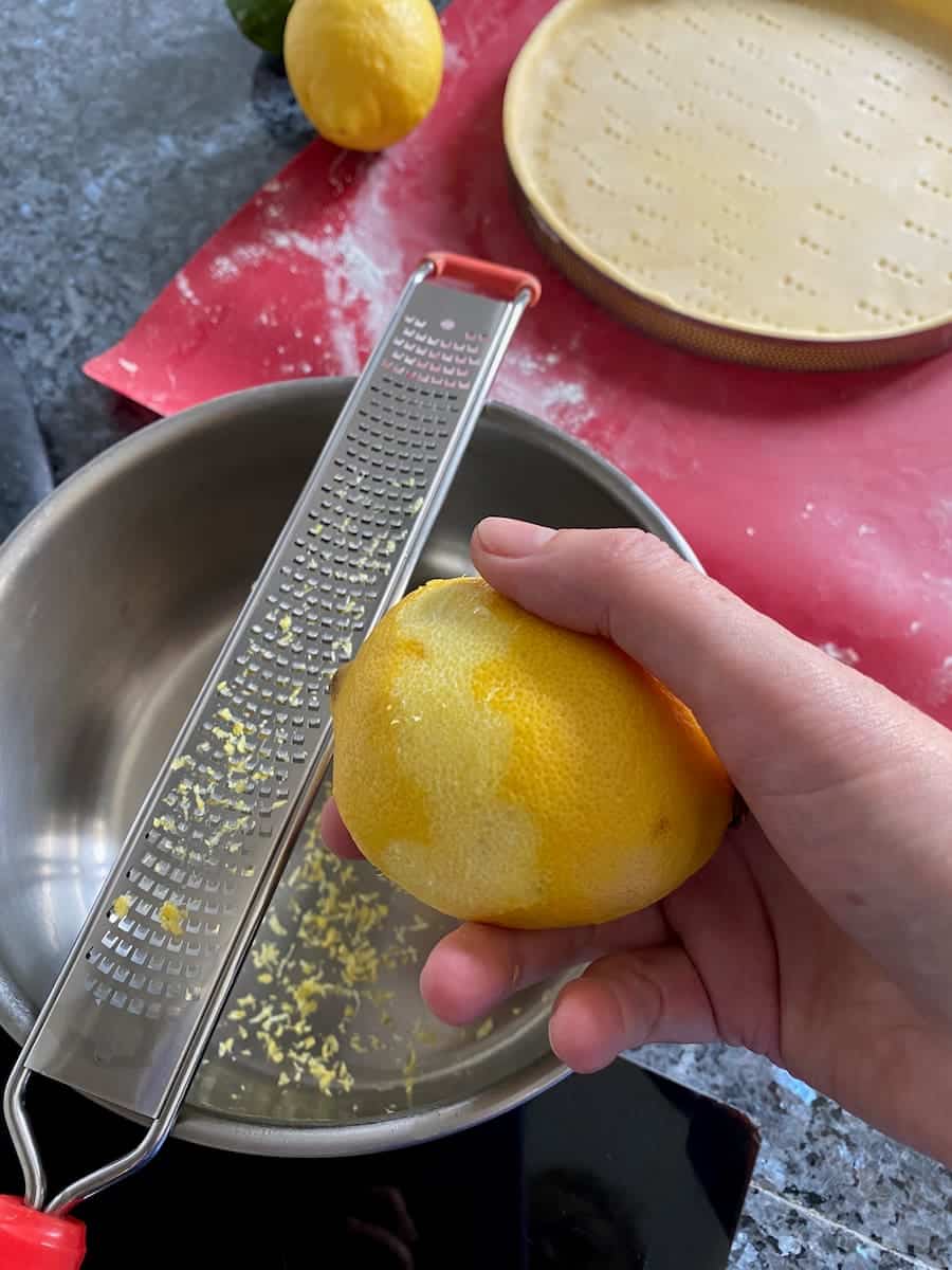 finely grating the lemon zest without the white pith underneath