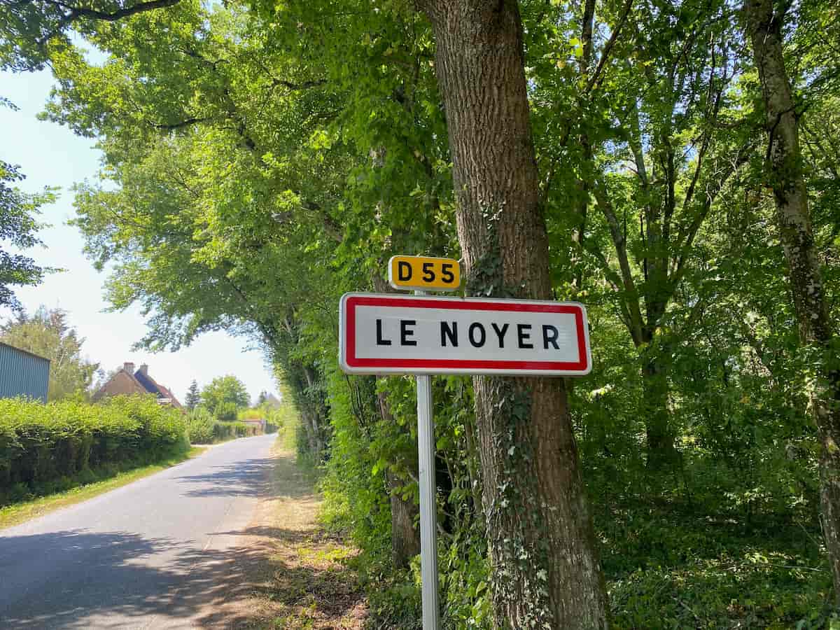 Signpost for the village called Le Noyer in France, which means walnut tree in French.