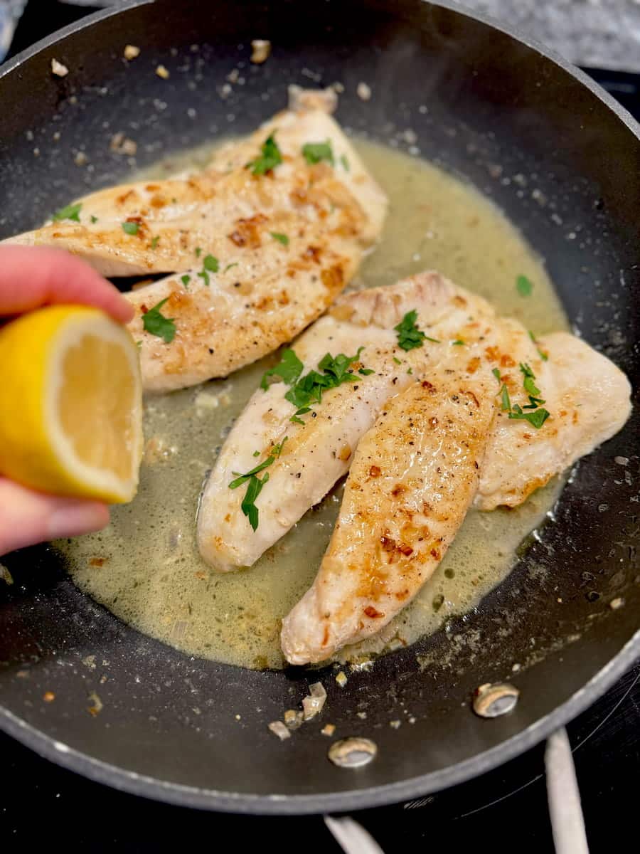 pan frying John Dory fish fillets in butter, oil, wine, shallots and lemon