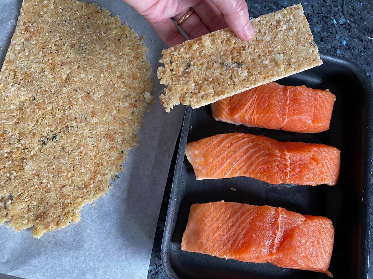 place the thin chilled herb crust cut to size on top of each salmon fillet