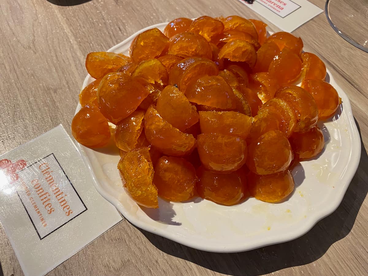 plate of quartered candied French clementines