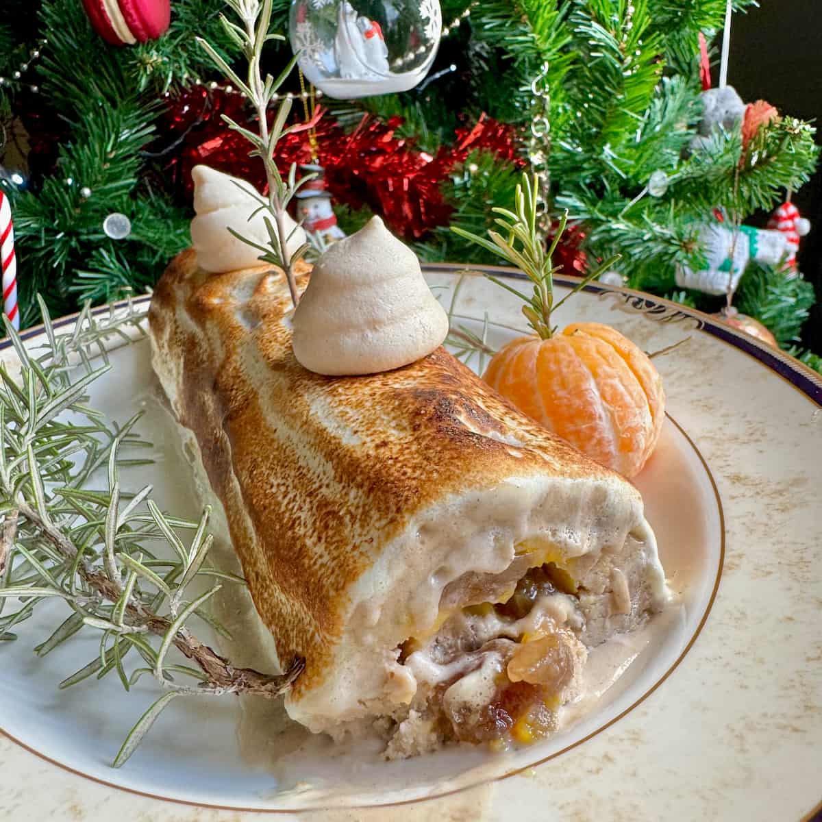 chestnut ice cream log filled with candied chestnuts, orange and topped with toasted meringue
