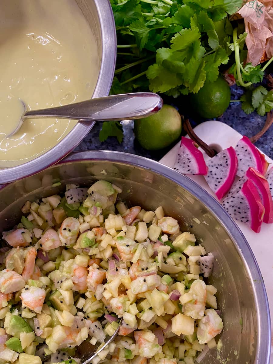 homemade mayonnaise with chopped dragon fruit, lime, herbs and tons of chopped up ingredients with shrimp