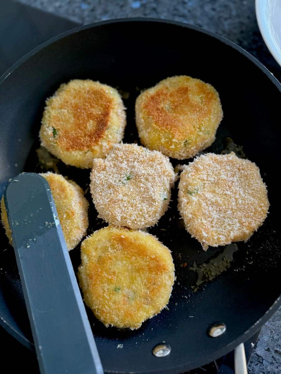 frying haddock fishcakes in a pan with olive oil