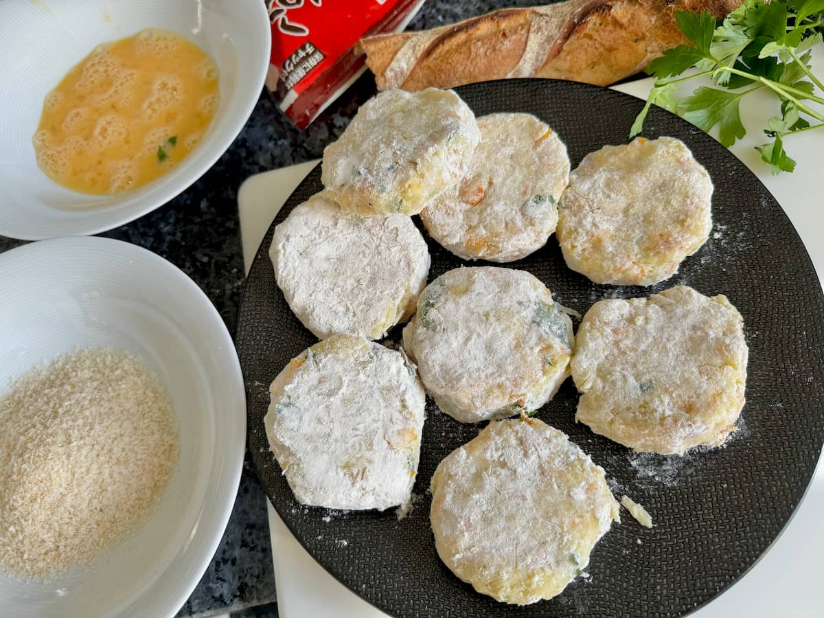 fishcake patties covered in flour ready to coat further