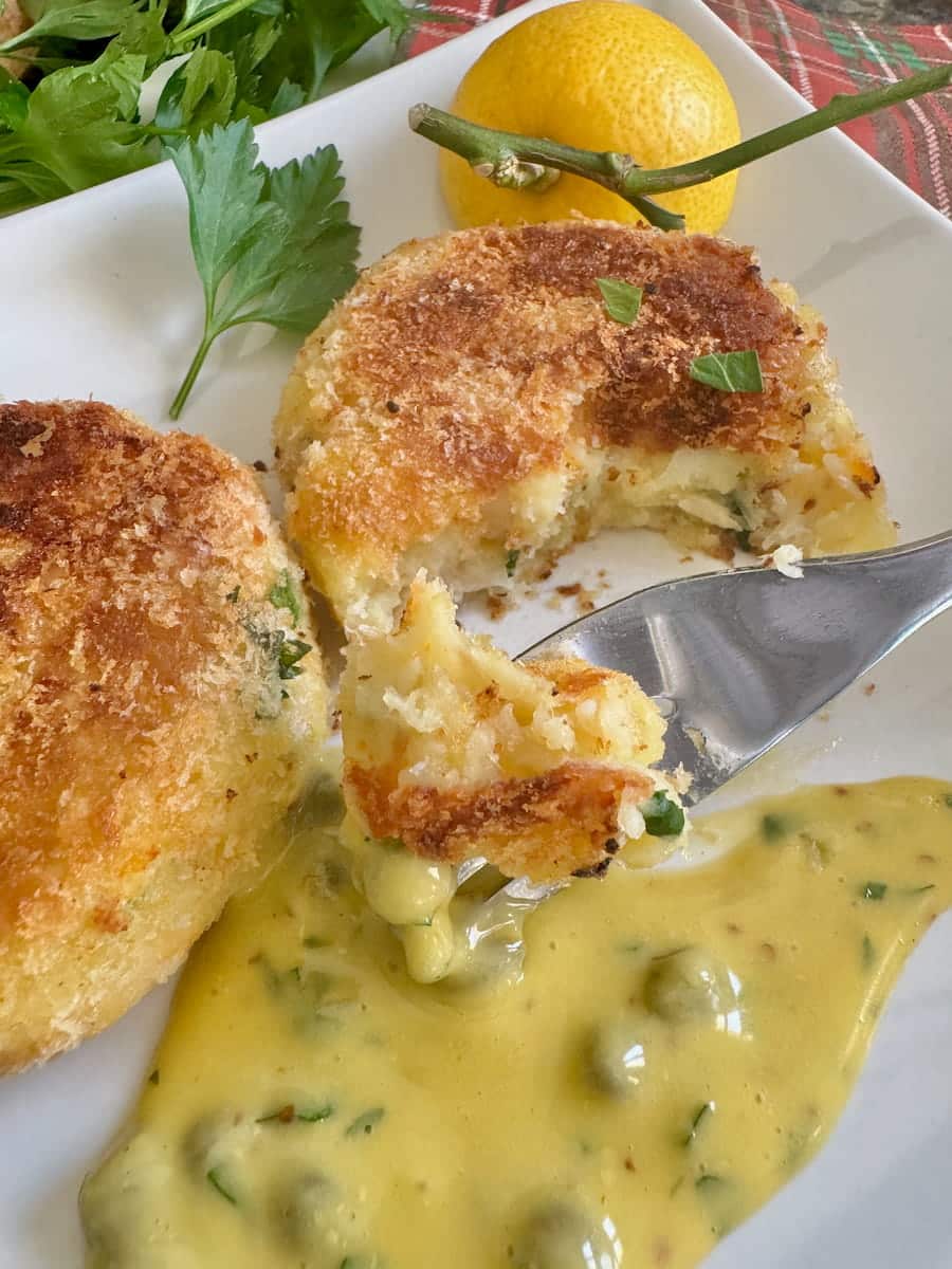 dipping fluffy smoked haddock fishcakes into a pool of Tartare sauce