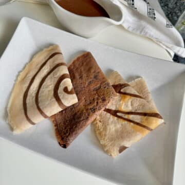 folded thin chocolate crepe pancakes 2 with designs