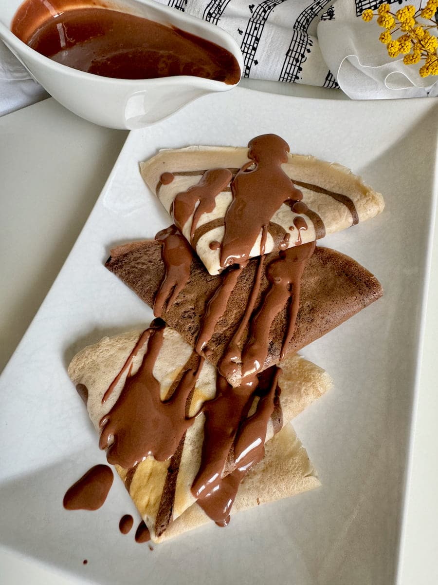 thin chocolate crêpes drizzled with a dark chocolate sauce
