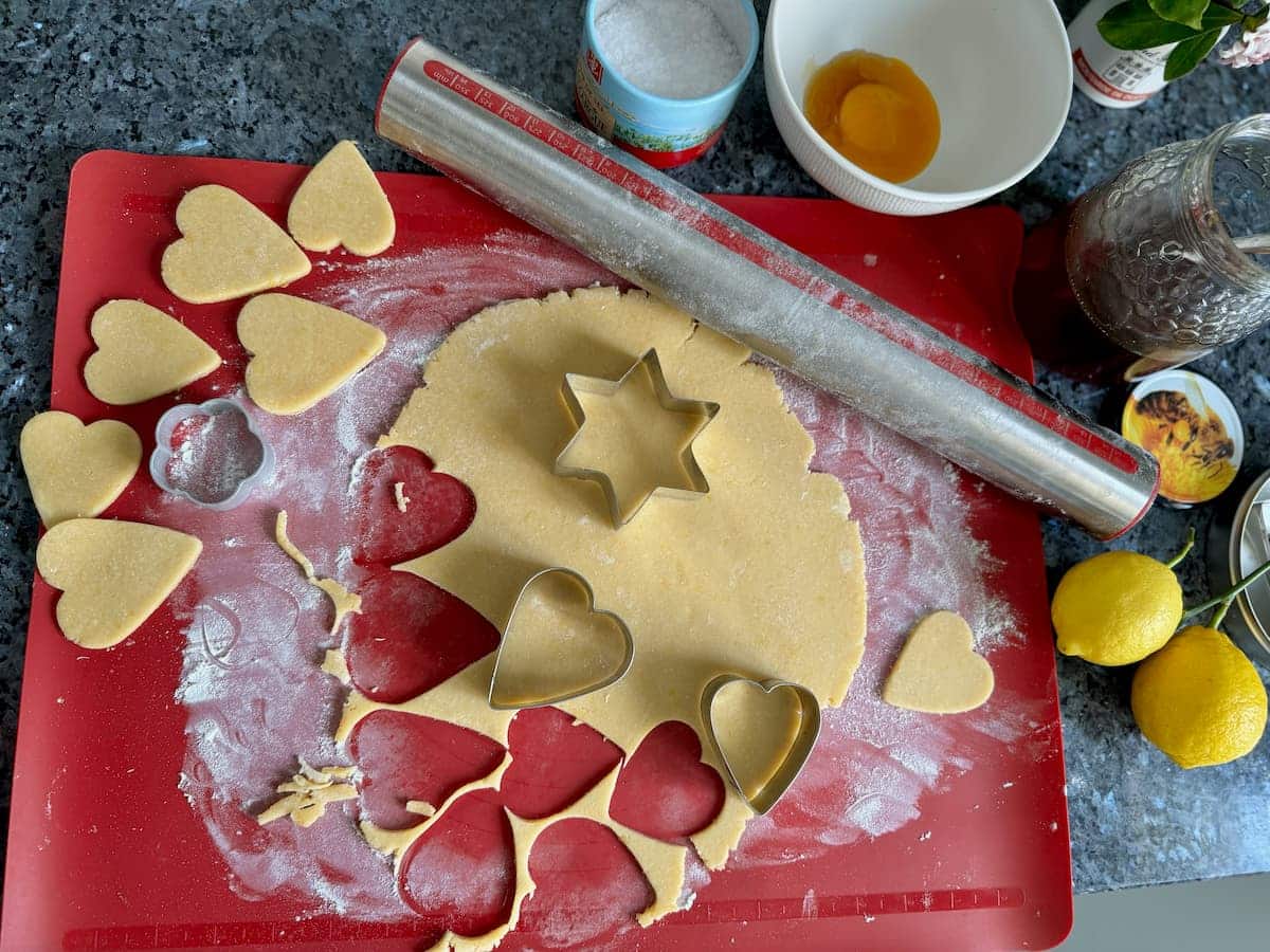 cutting out heart shaped biscuits or cookies