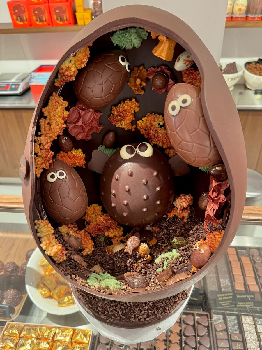 giant chocolate easter egg like an aquarium with various large-eyed blow fish 