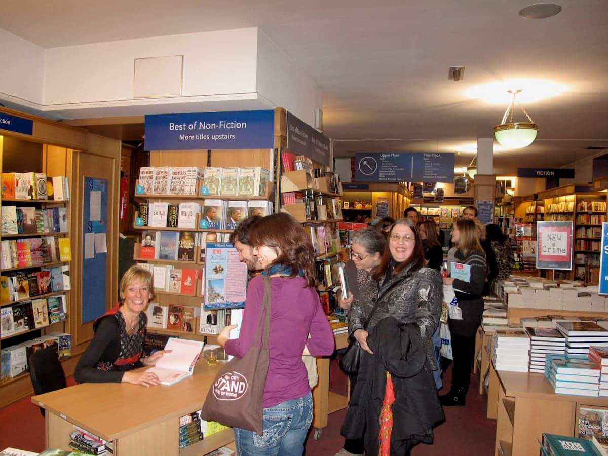 Jill Colonna signing books at the Mad About Macarons cookbook event in Paris bookshop, WHSmith