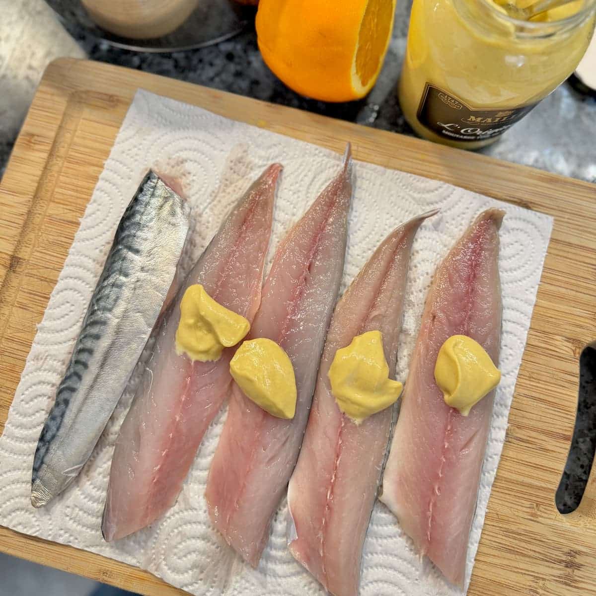 fillets of fresh mackerel fish topped with French Dijon mustard