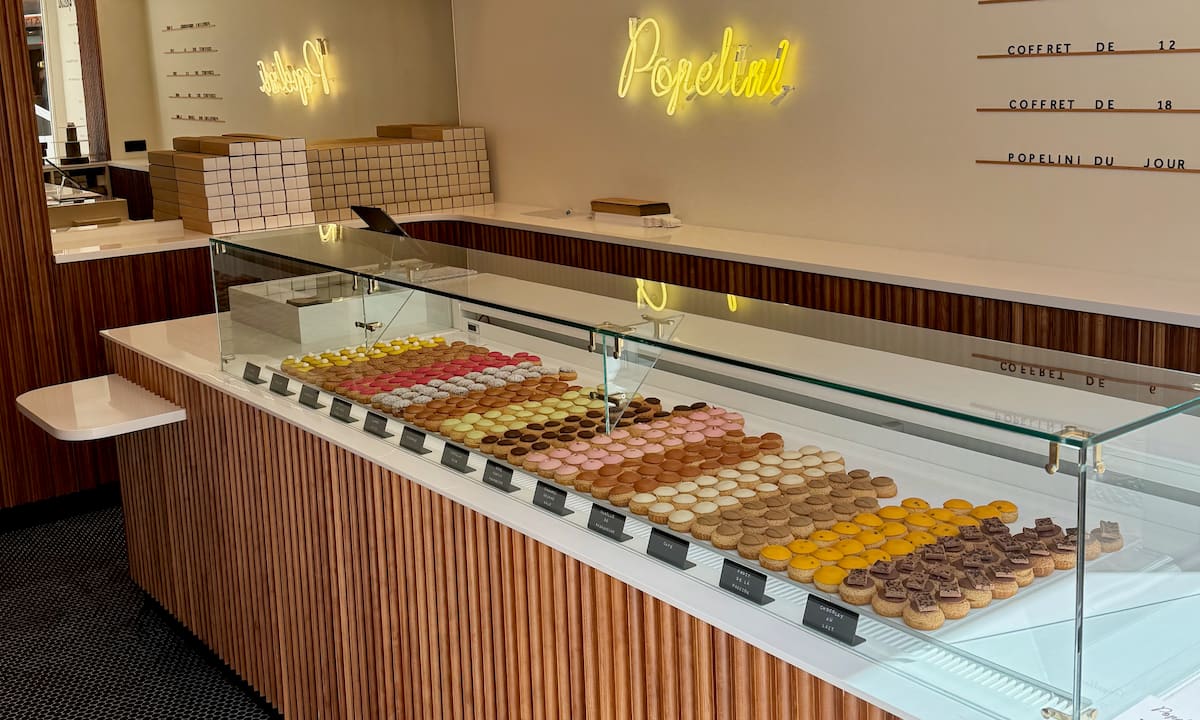 rows of choux puffs in a French store called Popelini