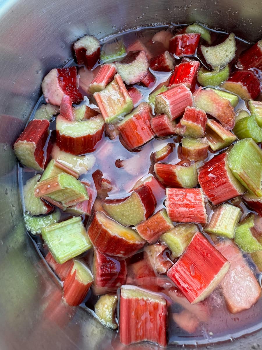 pan of chopped rhubarb next day after macerating in sugar, now turned to liquid with the fruit juices