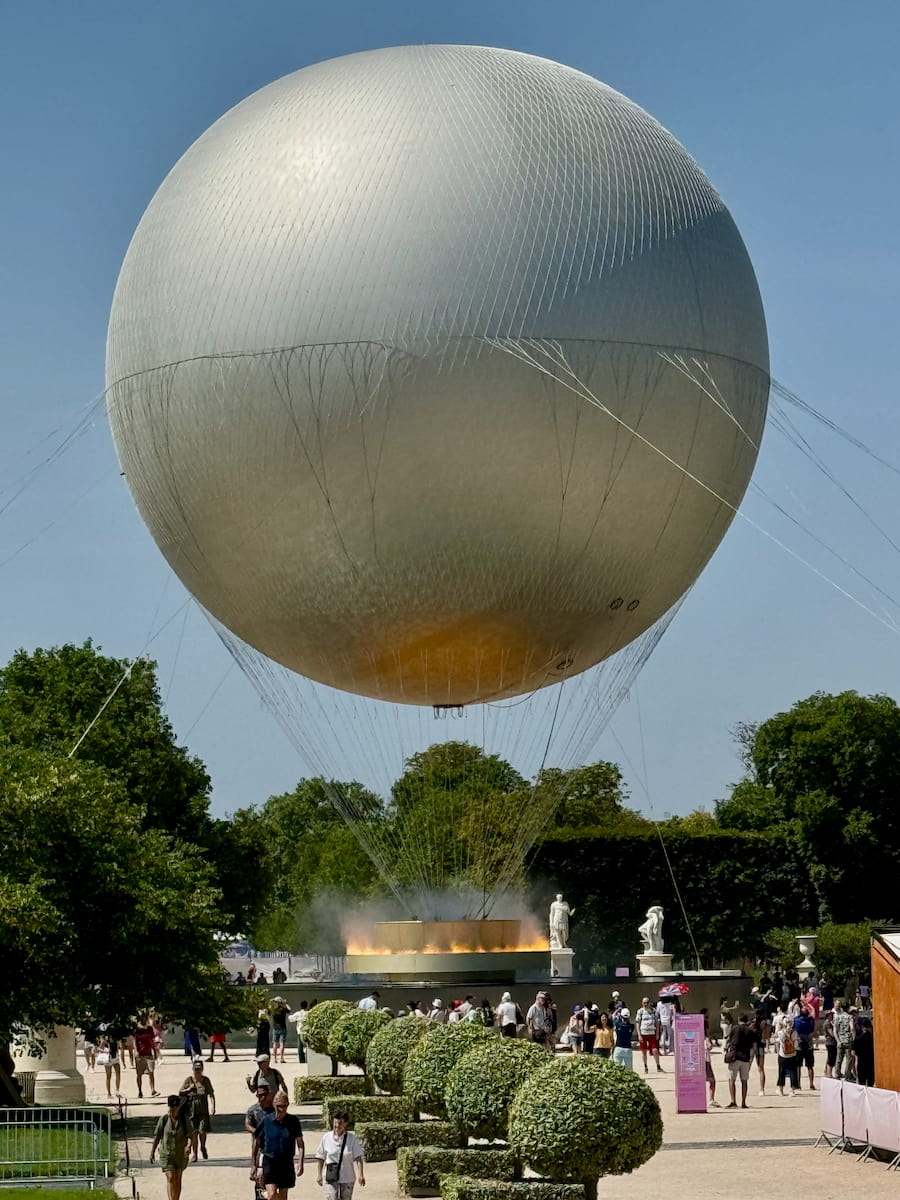 the large Paris Olympic Balloon Cauldron in the Tuileries Garden, complete with its electric illusion of fire