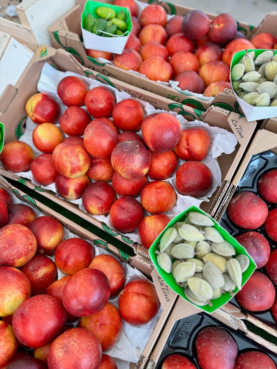 crates of smooth skinned nectarines at the French market