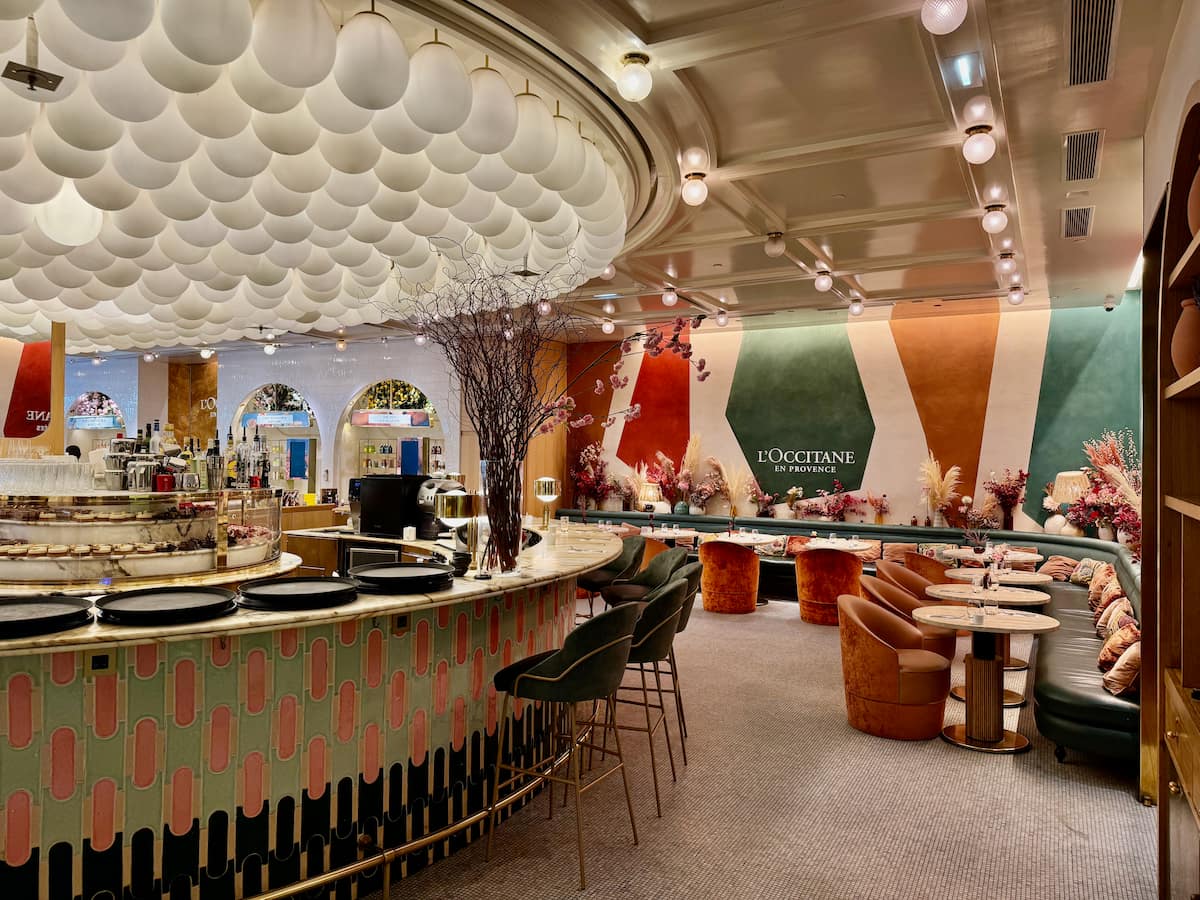 stylish pastry bar and spacious tearoom with plush seats at 86 Champs Elysées by Occitane and Pierre Hermé