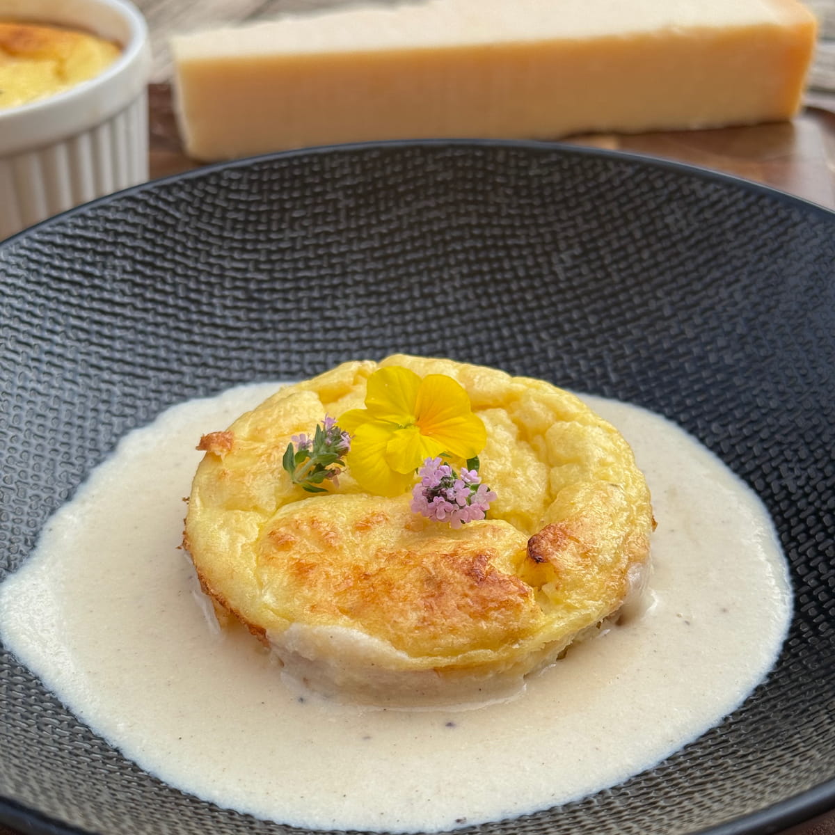 parmesan sauce underneath an asparagus clafoutis