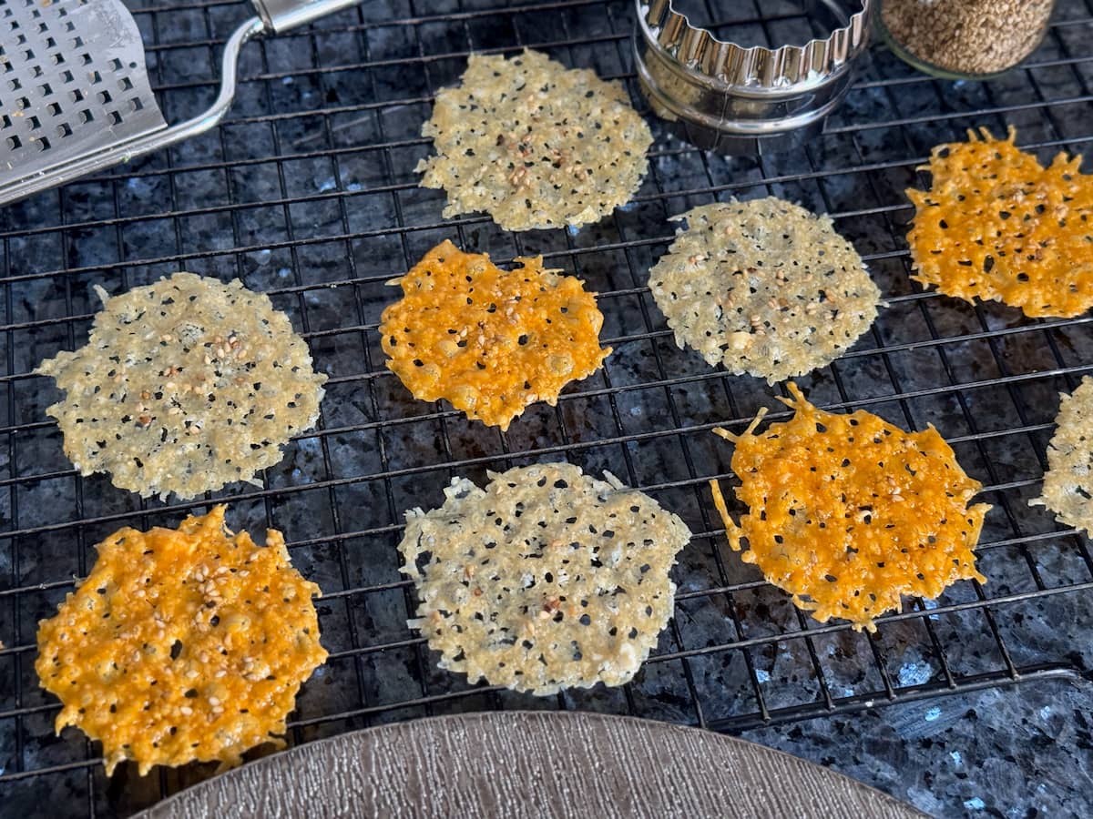 Parmesan crisps cooling on a wire rack just out of the oven