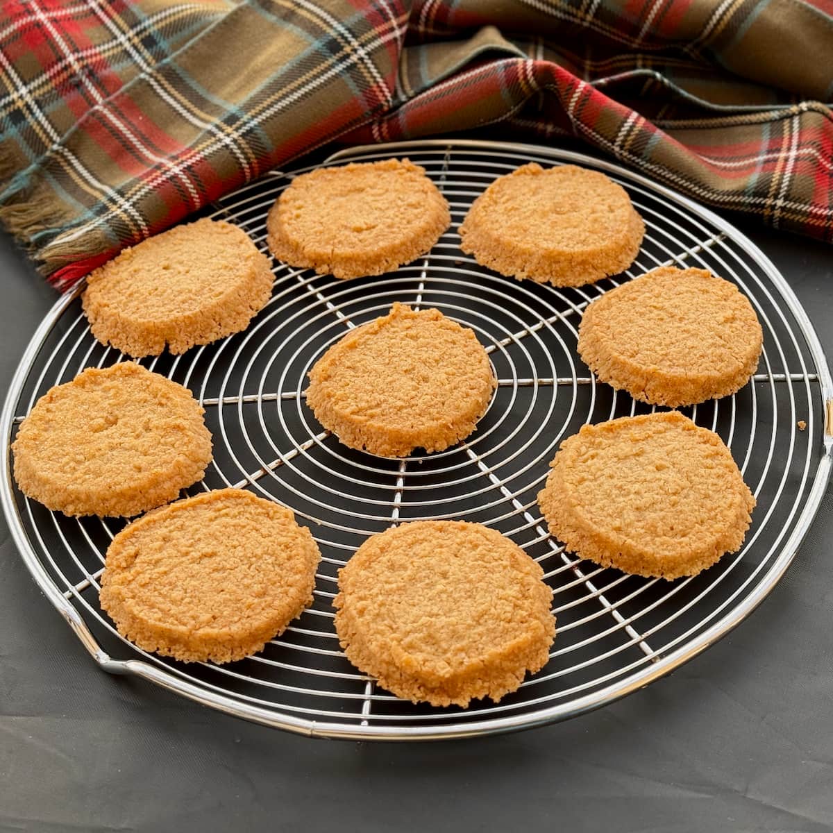 golden buttery shortbread rounds cooling on a wire tray