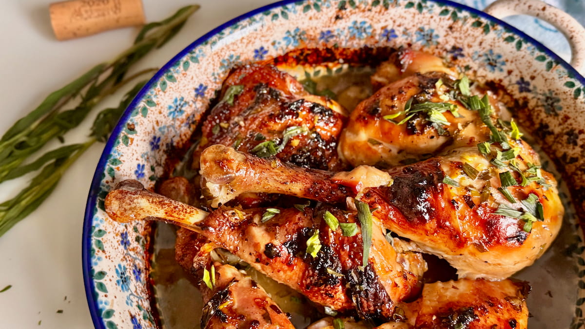Really tender lemon chicken thighs baked in the oven with tarragon herbs, garlic and honey