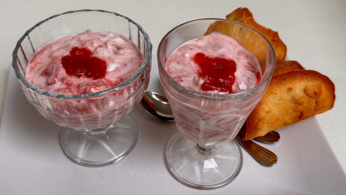 Quick rhubarb fool dessert in glass bowls topped with bright red rhubarb compote