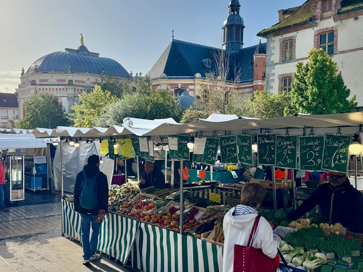 sunny market morning in front of the church in Fontainebleau