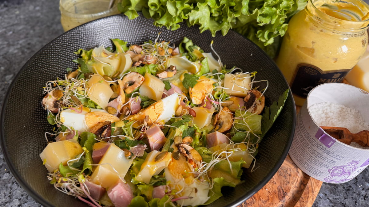 French ham and cheese salad topped with microgreens and toasted pumpkin seeds